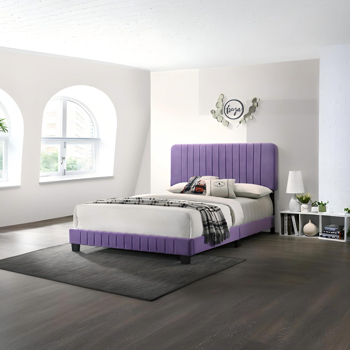 Channel tufted bed with purple upholstered headboard and base in a modern bedroom with white bedding on Tampa Home & Garden Store