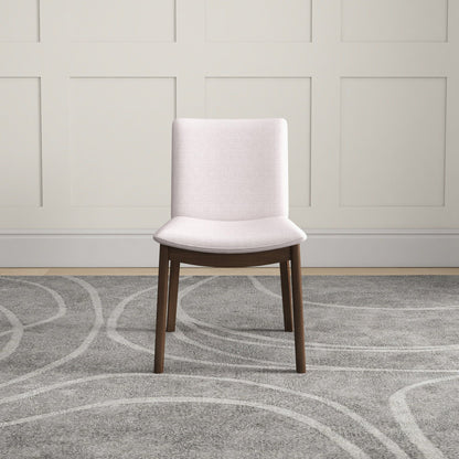 Mid-Century Modern solid wood dining chair with cream fabric upholstery and dark wood legs on Tampa Home & Garden Store
