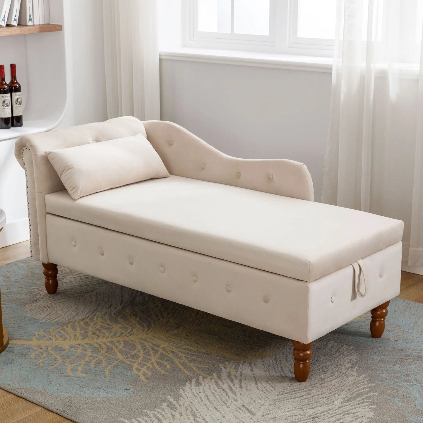 Beige upholstered chaise lounge with rolled arms, nailhead trim, and a matching pillow in a bright bedroom on Tampa Home & Garden Store
