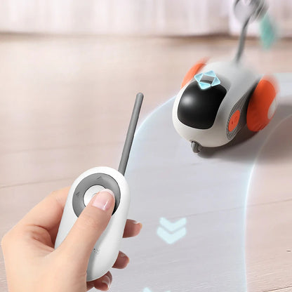 Remote control interactive cat car toy, white body, gray remote, blue bow, USB charging on Tampa Home & Garden Store