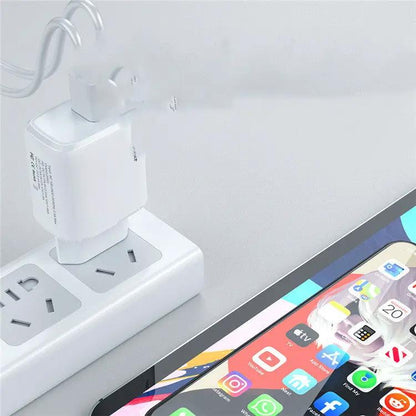 Mobile Phone Charger Fast Charge Adapter, white, plugged into a power strip beside a tablet on Tampa Home & Garden Store
