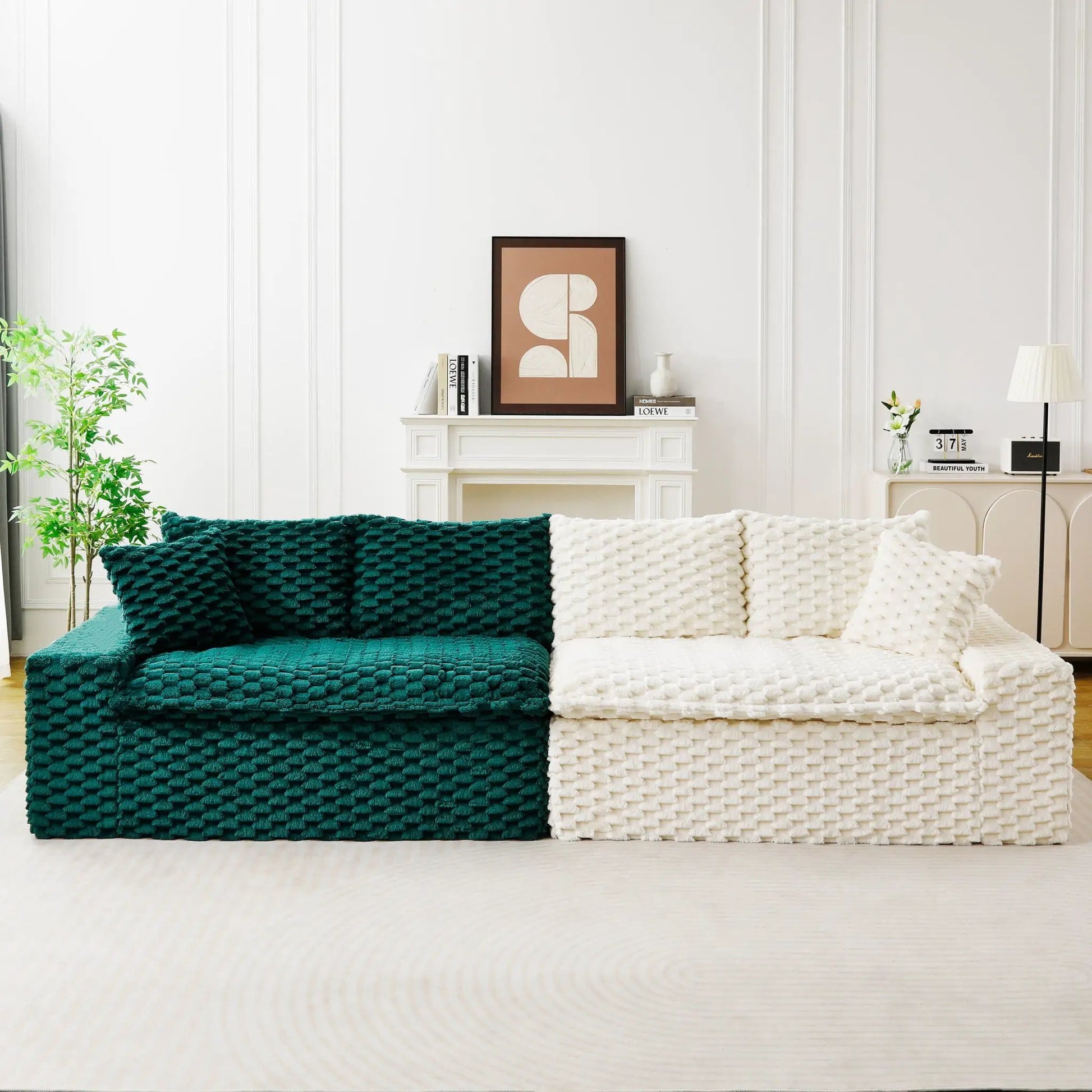 Multifunctional sofa with teal and cream chunky-knit blankets in a white paneled living room on Tampa Home & Garden Store