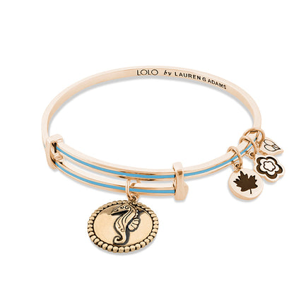 Lolo Seahorse Bangle by Lauren G Adams in rose gold tone with blue enamel bands and charm on Tampa Home & Garden Store