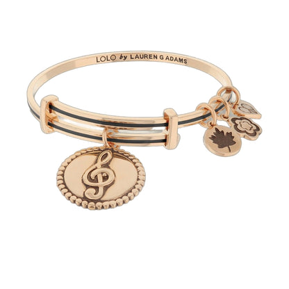 Lolo Music Bangle by Lauren G Adams in rose gold tone with stacked bands and charms on Tampa Home & Garden Store