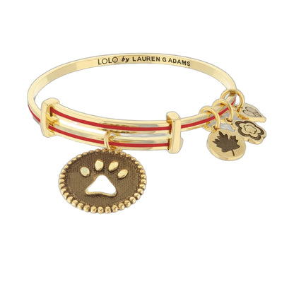 Lolo Dog Paw Bangle by Lauren G Adams, gold with red enamel stripes and paw charms on Tampa Home & Garden Store