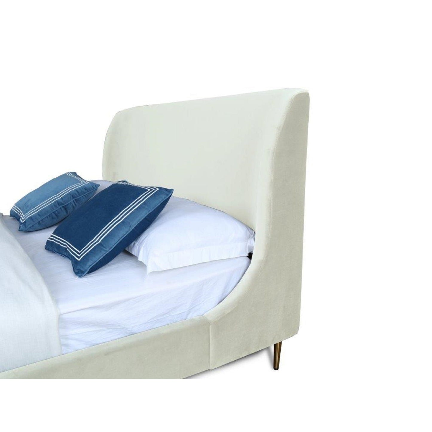 Heather upholstered bed with curved cream headboard, white bedding and blue pillows on Tampa Home & Garden Store