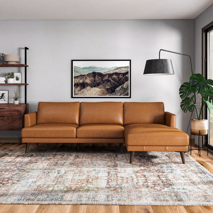 Lore L-shaped sectional sofa in tan leather with dark tapered legs in a modern living room by HouseOfZazla on Tampa Home & Garden Store