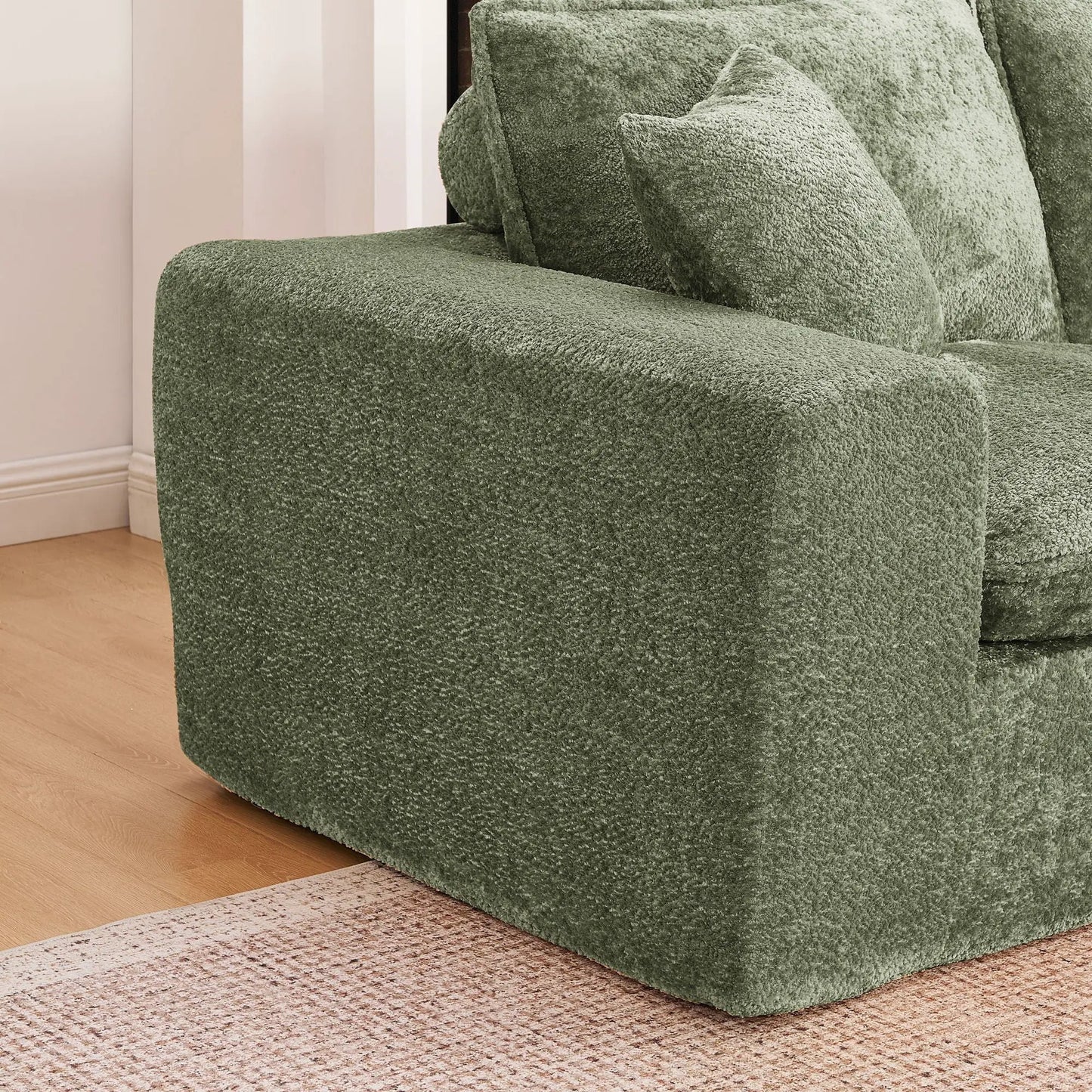 Sectional sofa with moveable ottoman in green textured fabric on Tampa Home & Garden Store