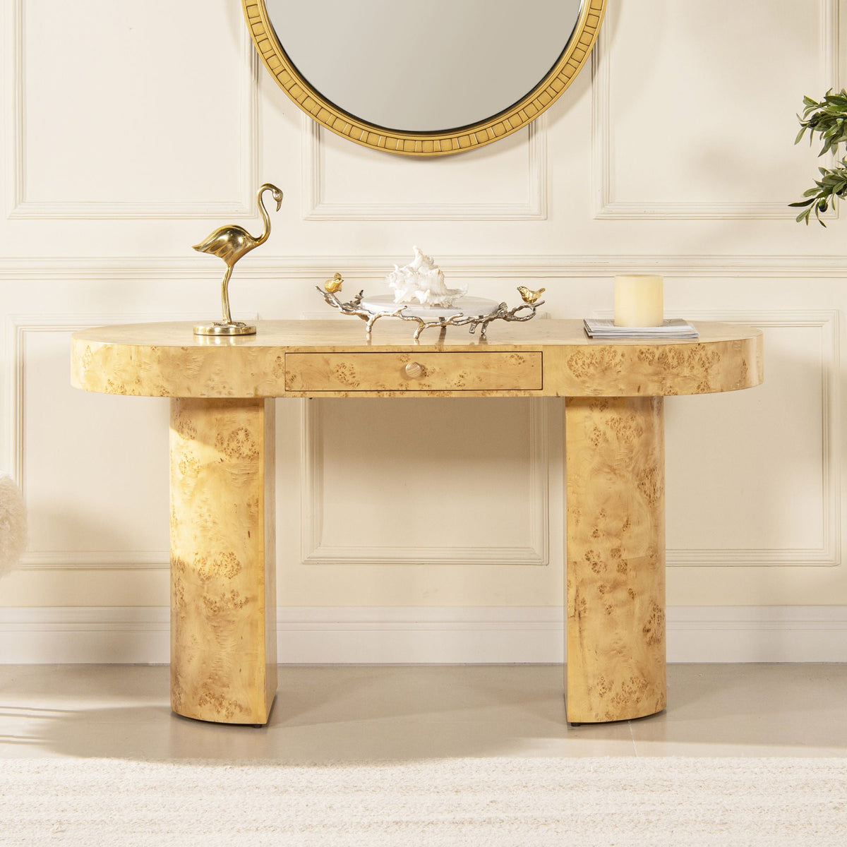 Oval burl wood veneer computer desk with single front drawer beneath a round gold-framed mirror on Tampa Home & Garden Store