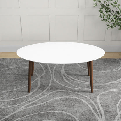 Mid-century modern oval dining table with white top and solid wood legs on Tampa Home & Garden Store