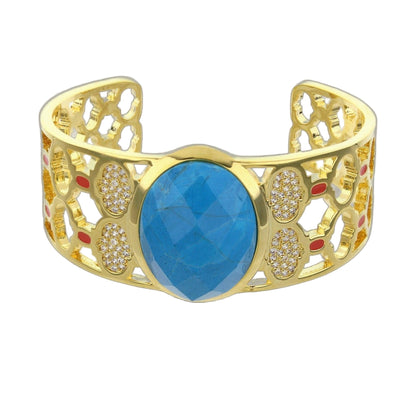 Dragon Lady Bangle cuff bracelet by Lauren G Adams with gold-tone filigree and blue centerpiece on Tampa Home & Garden Store