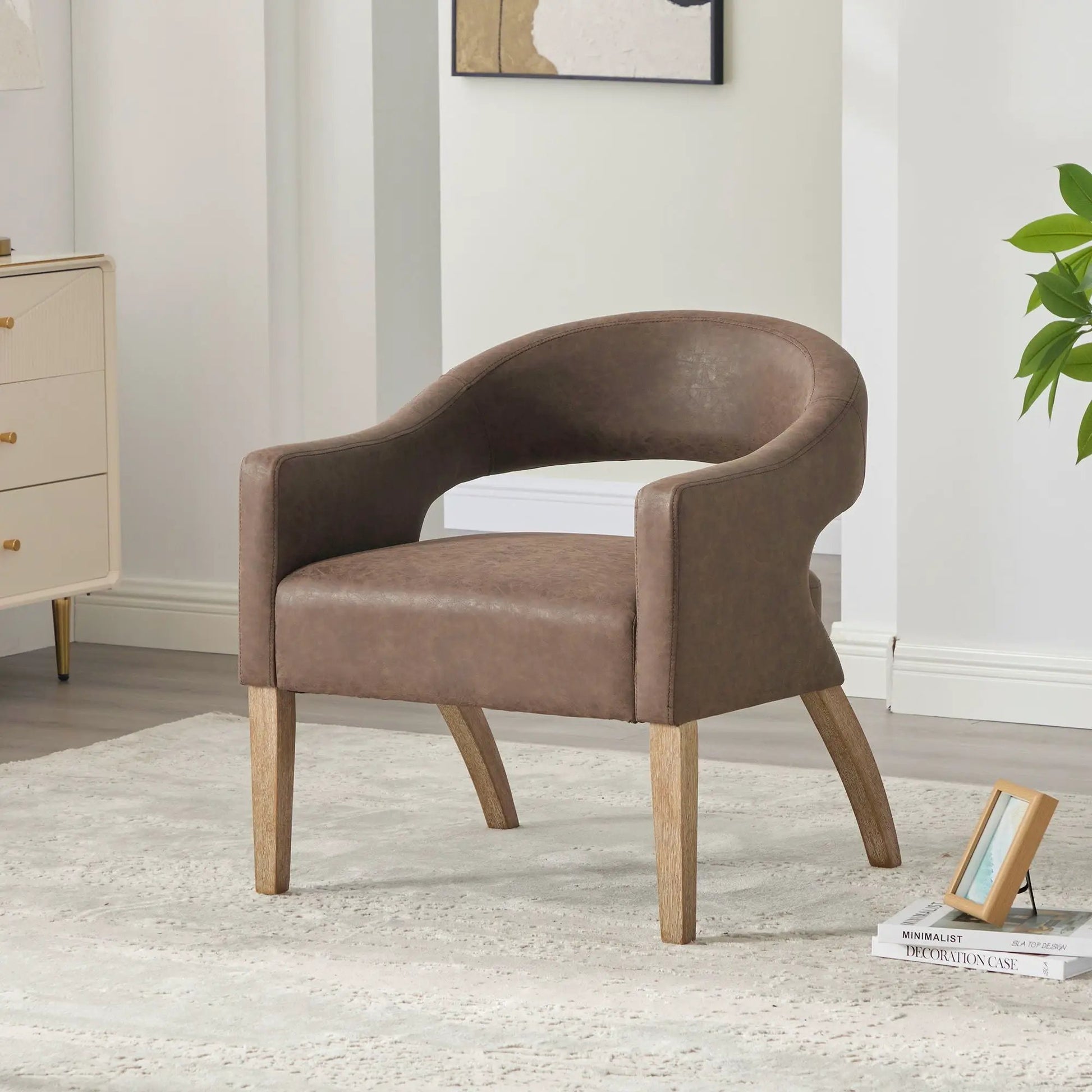 Upholstered armchair with weathered rubberwood legs, leatherette upholstery in a living space on Tampa Home & Garden Store