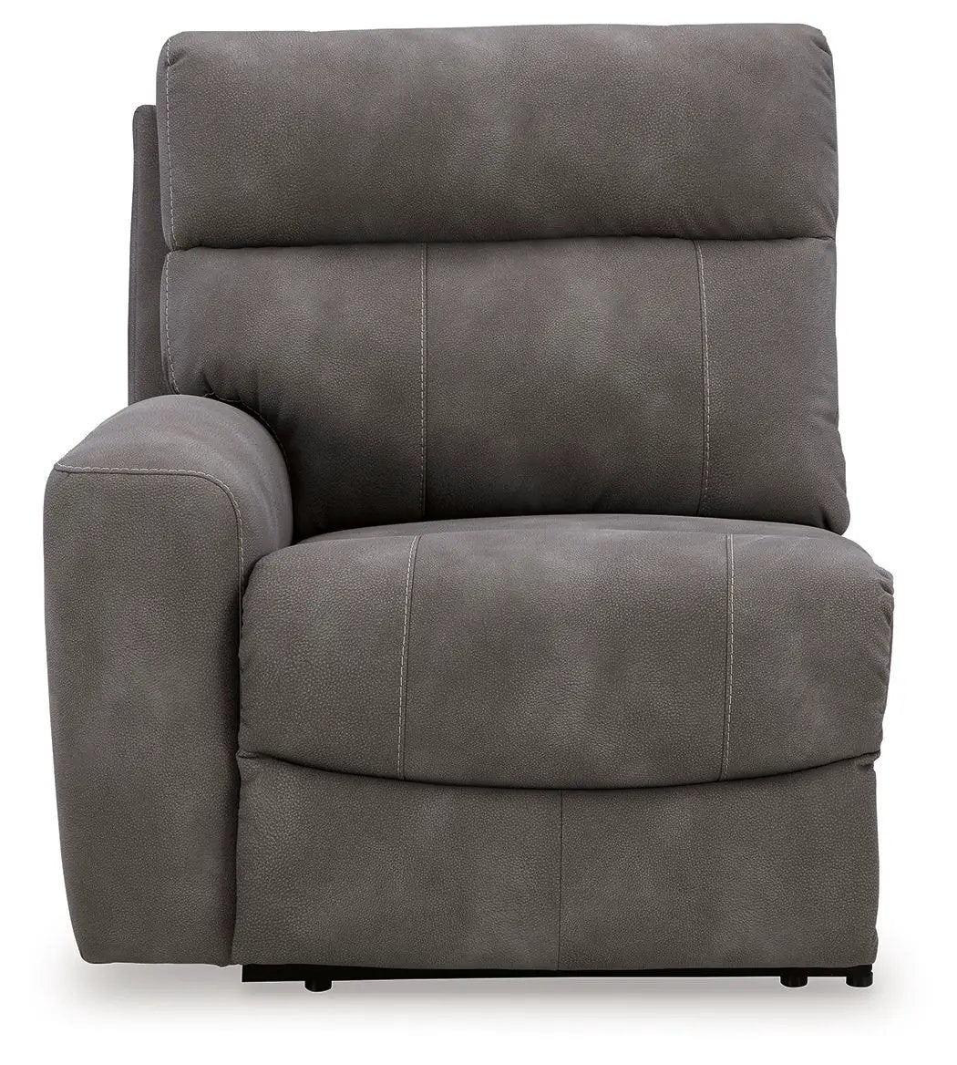 Next-Gen Durapella reclining sectional chair in dark gray faux leather with stitching on Tampa Home & Garden Store