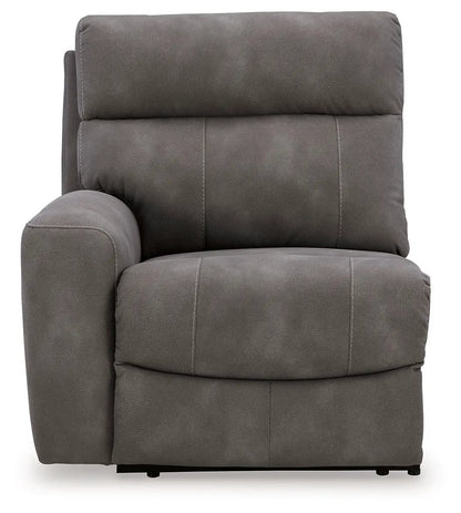 Next-Gen Durapella reclining sectional chair in dark gray faux leather with stitching on Tampa Home & Garden Store