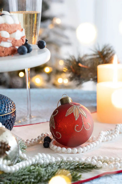 Christmas ball ornament red glass with silver glitter leaf motif, surrounded by pearl strands on Tampa Home & Garden Store