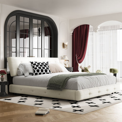 Tufted white upholstered bed with gray bedding and a black polka dot pillow in luxe bedroom on Tampa Home & Garden Store
