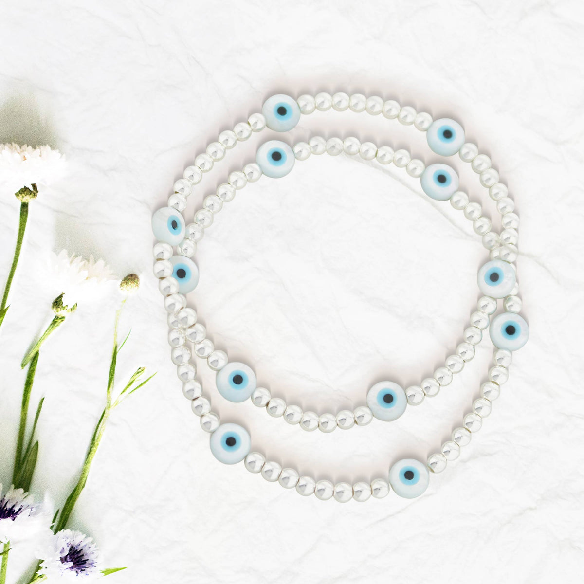 Lorelai Evil Eye 3mm Beads Bracelet with white seed beads and blue eye charms by Lauren G Adams on Tampa Home & Garden Store
