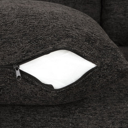 Sleeper sectional couch close-up in black textured fabric with visible zipper and white lining on Tampa Home & Garden Store