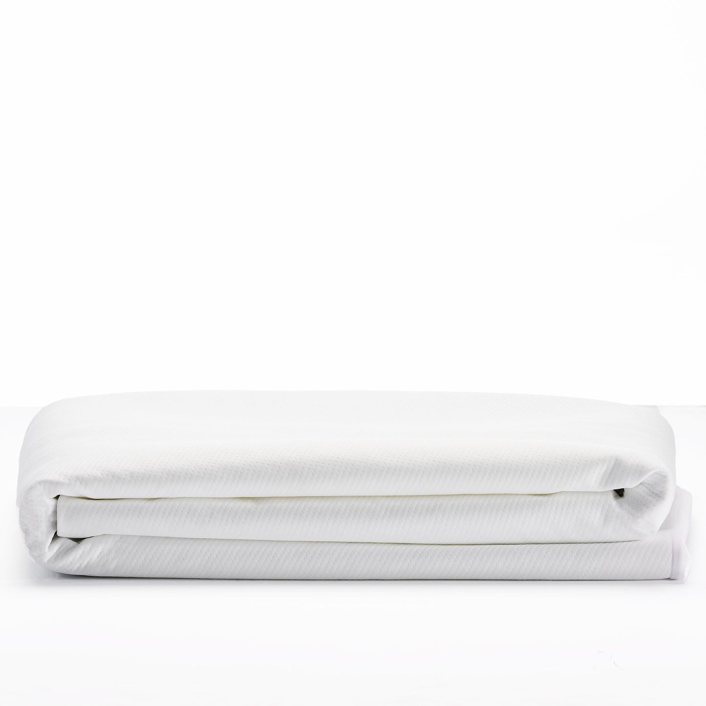 OkiOki Mattress Protector Queen white textured cover folded on a bed on Tampa Home & Garden Store
