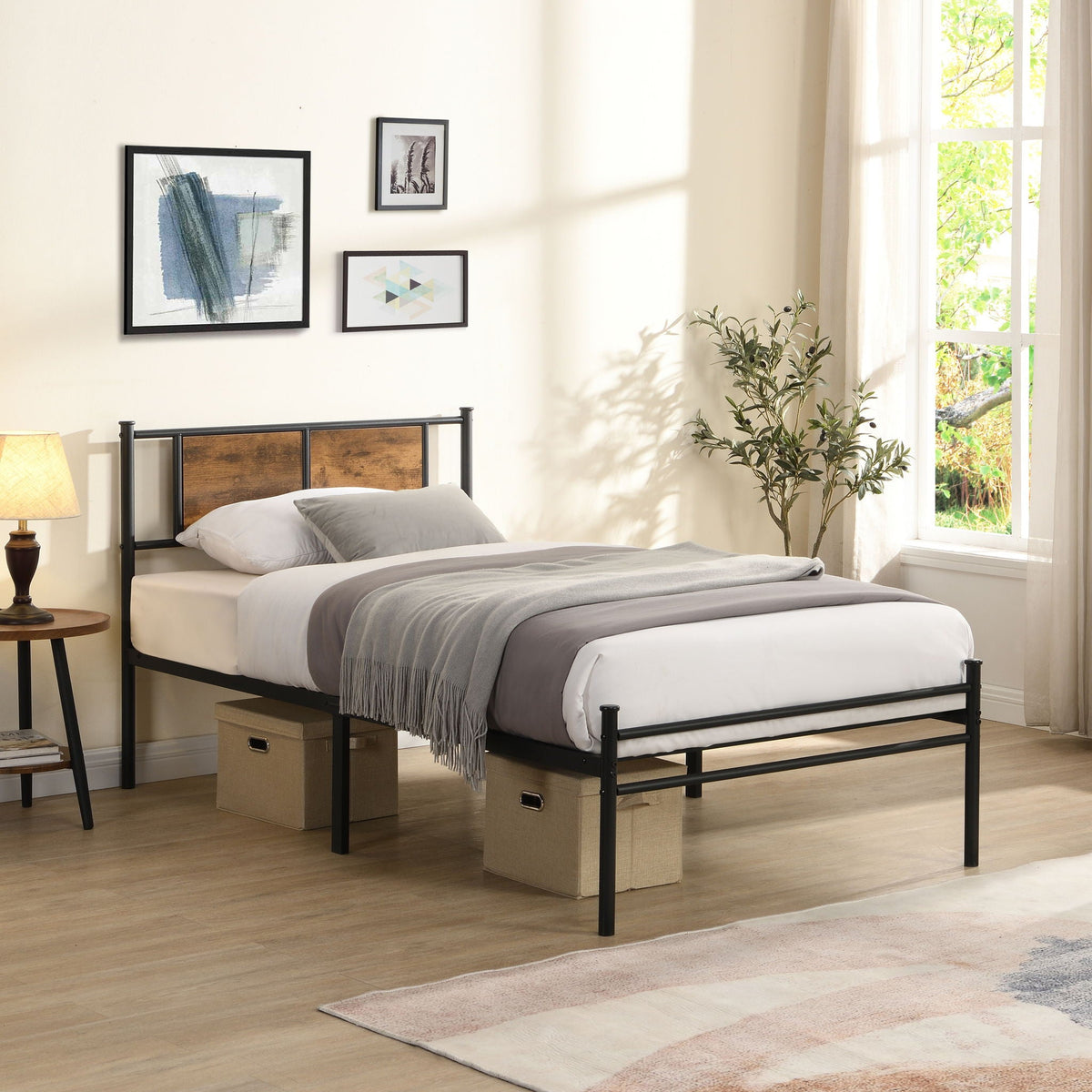 Modern black metal platform bedframe with wood-panel headboard in a bright bedroom on Tampa Home & Garden Store
