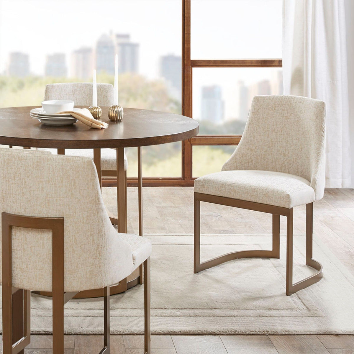 Modern accent dining chairs with beige upholstered cushions around a round table HouseOfZazla on Tampa Home & Garden Store