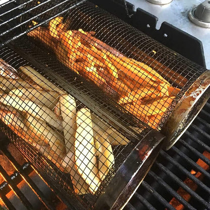 Rolling grilling basket metal BBQ mesh net over flames on a portable outdoor grill on Tampa Home & Garden Store