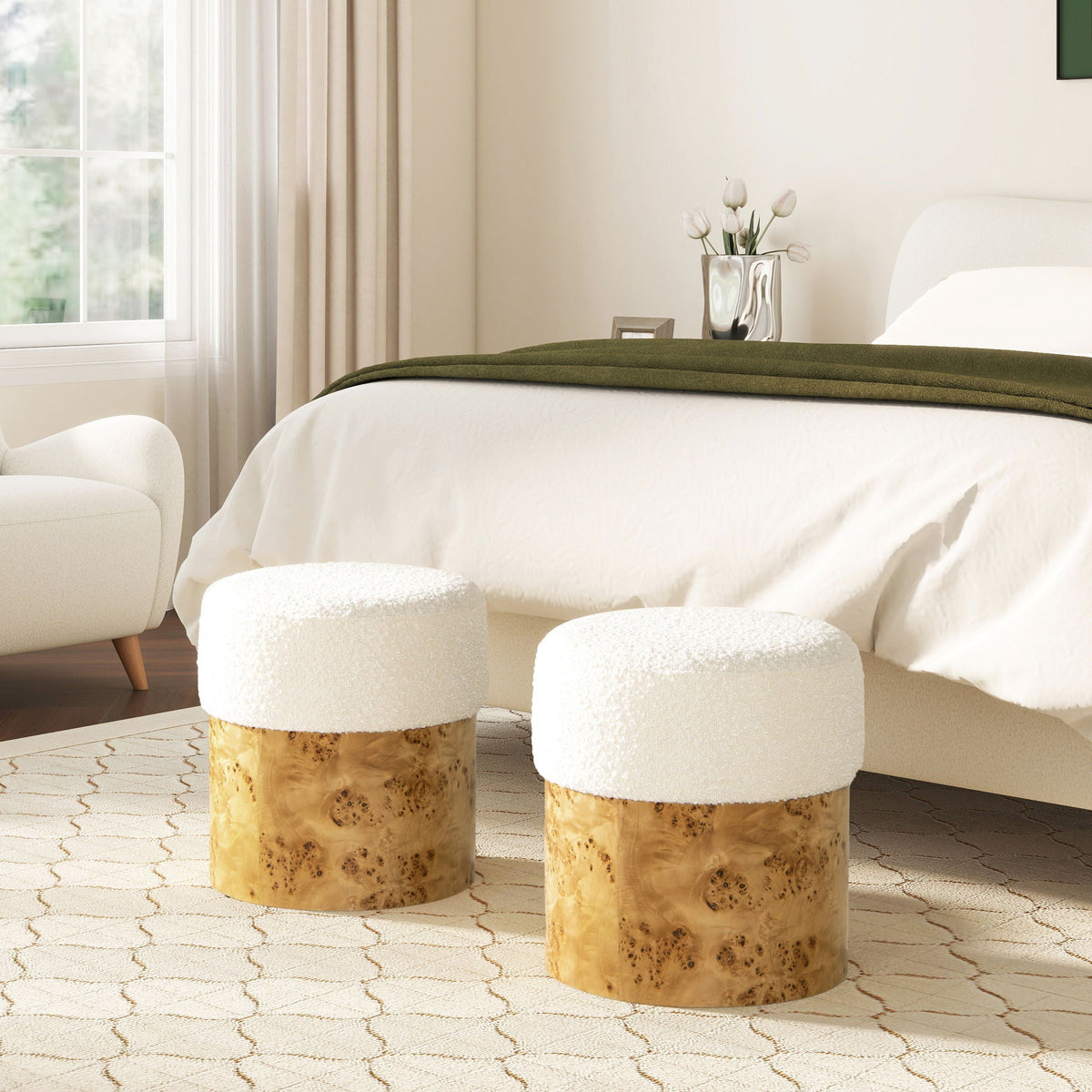 Round white boucle upholstered ottoman with burl wood base in a bright bedroom scene on Tampa Home & Garden Store