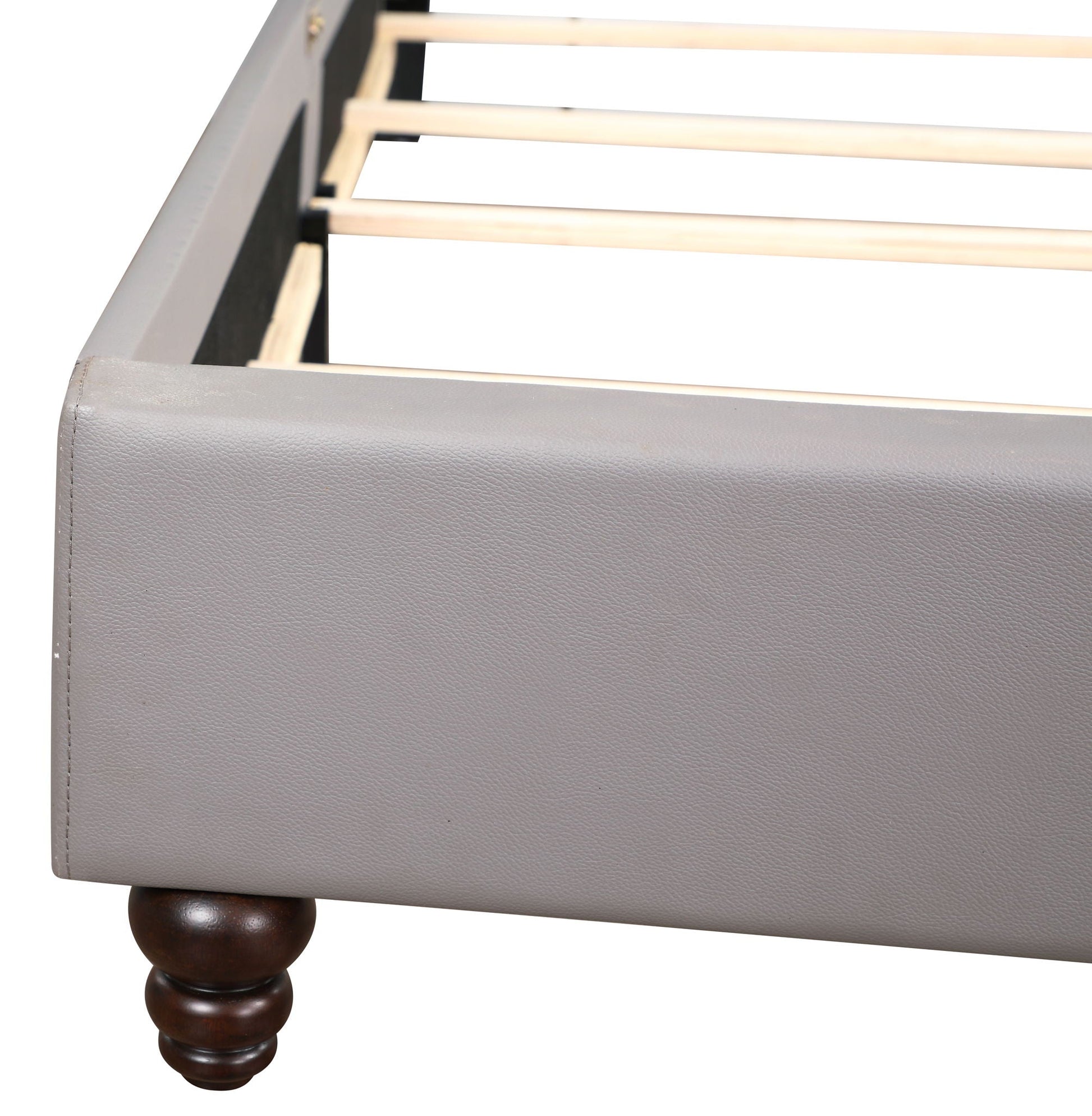 Nailhead Bed footboard in gray upholstery with dark wood turned leg on Tampa Home & Garden Store