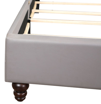 Nailhead Bed footboard in gray upholstery with dark wood turned leg on Tampa Home & Garden Store