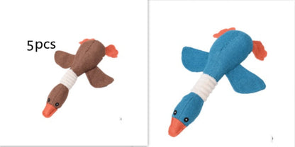 Plush Dayan dog toy pair in brown and blue with orange beak, squeaky puzzle toy on Tampa Home & Garden Store