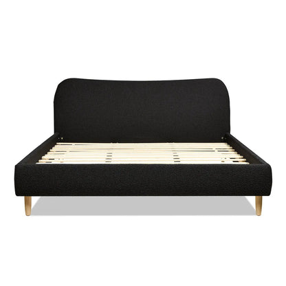 Roman curved headboard upholstered platform bed in black fabric with wood legs on Tampa Home & Garden Store