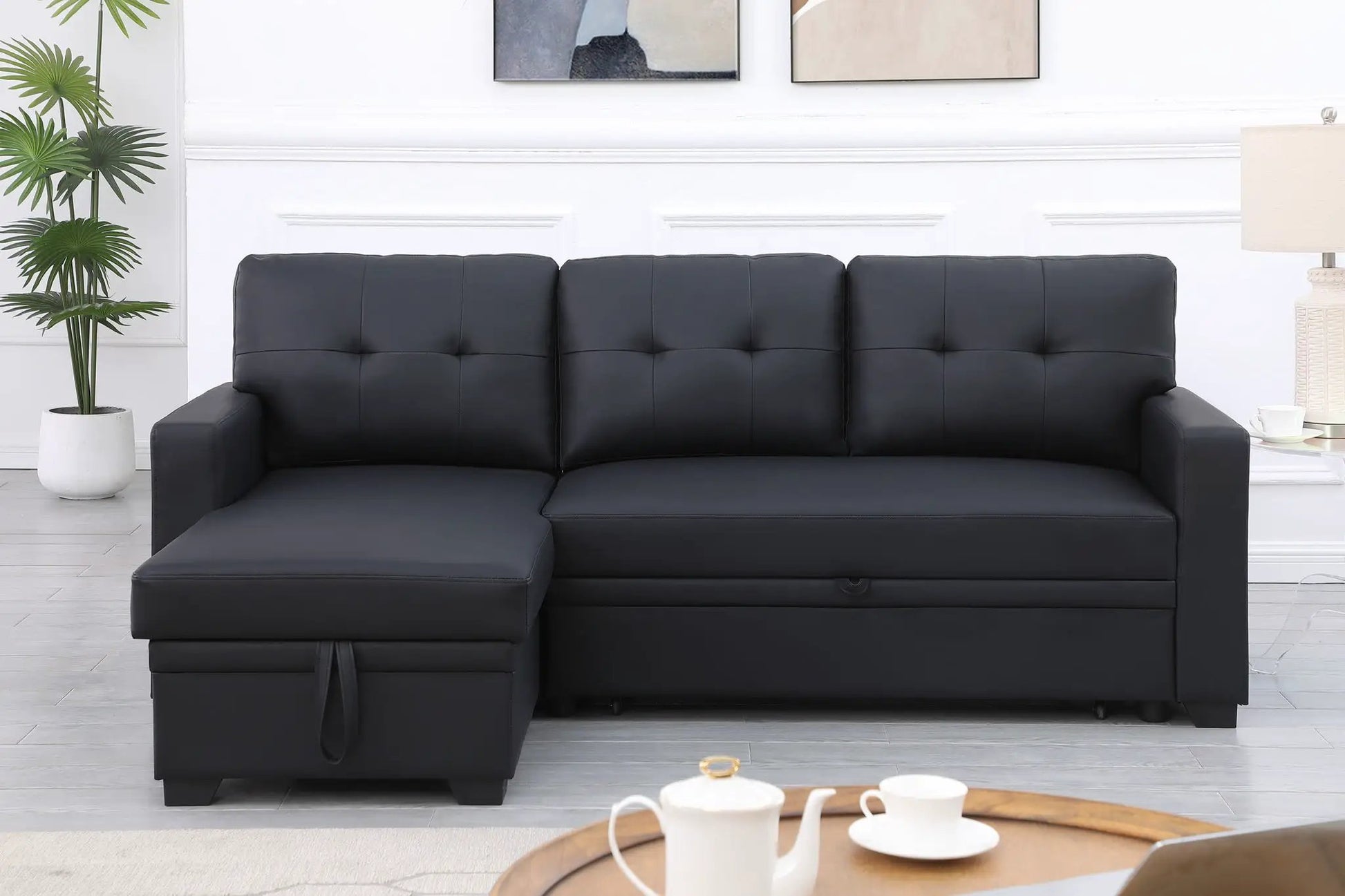Upholstered pull-out sleeper sectional with chaise in black faux leather by Unique Piece Furniture on Tampa Home & Garden Store