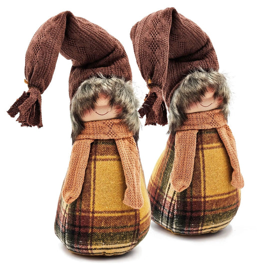 Two gnome decorations in brown knit hats with plaid yellow outfits and fur trim on Tampa Home & Garden Store