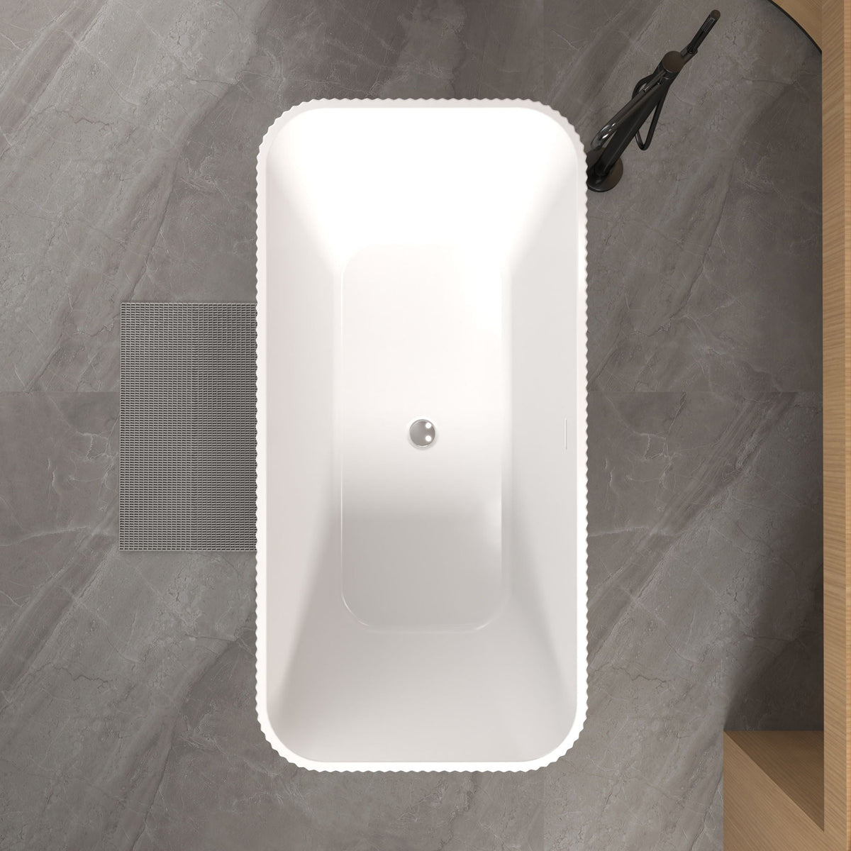 Linear freestanding soaker tub in gloss white with a black faucet mounted on the right on Tampa Home & Garden Store