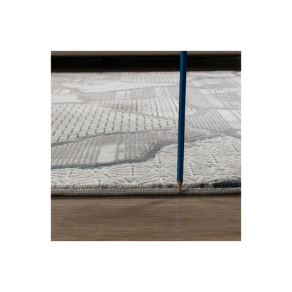 Contemporary geometric gray area rug with textured pattern on hardwood floor with blue pencil on Tampa Home & Garden Store