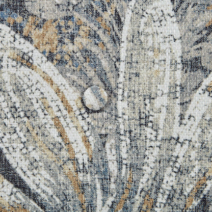 Area rug with abstract multicolor pattern in blue, tan, and gray tones on Tampa Home & Garden Store