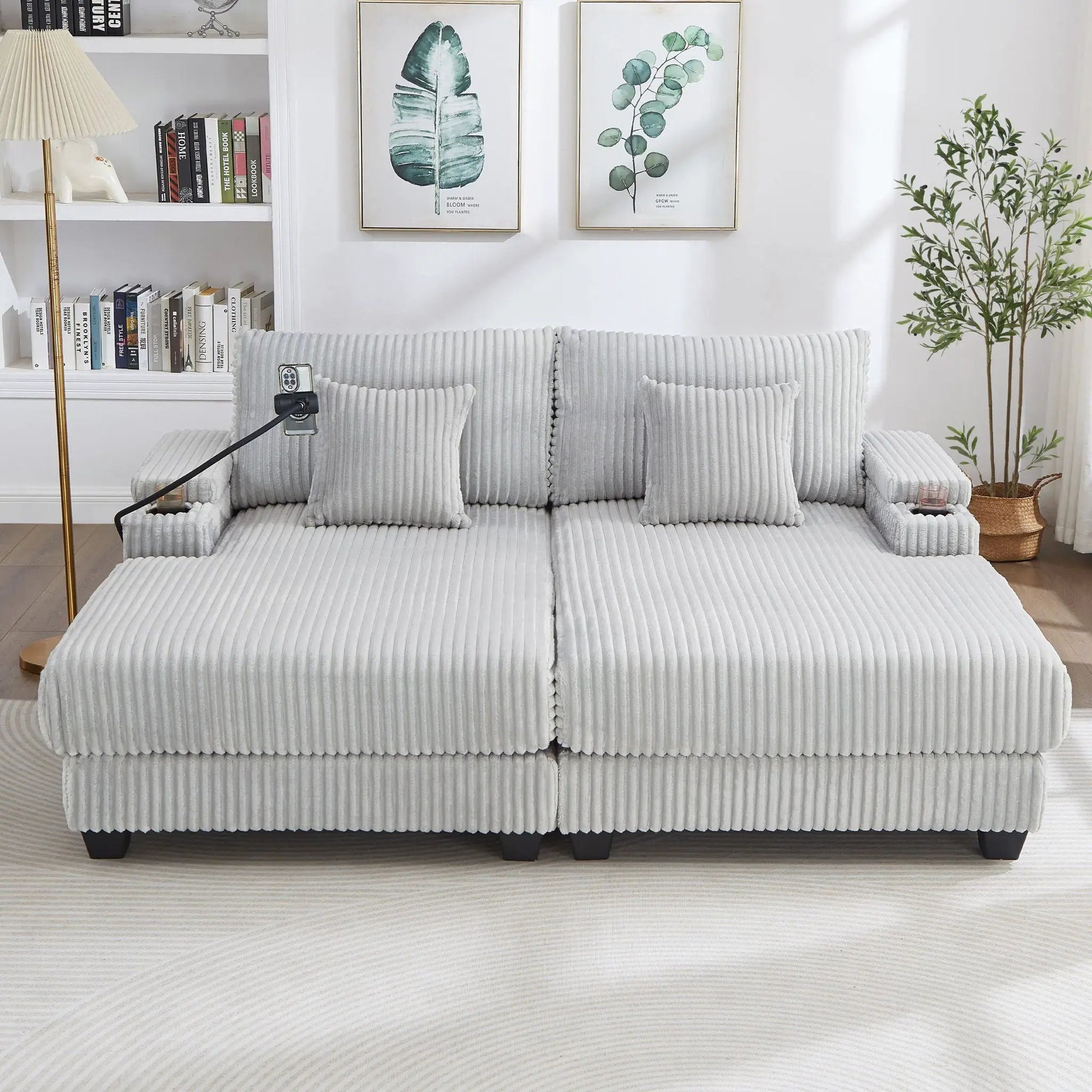 Modern gray ribbed fabric chaise sofa sectional with cushioned arms in a bright living room on Tampa Home & Garden Store
