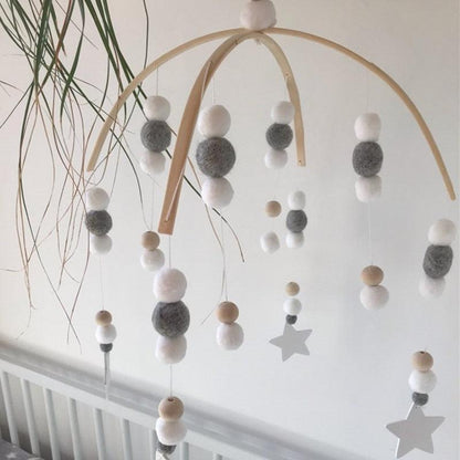 Baby Nordic wooden bead wind chime mobile with white and gray wool balls and star accents on Tampa Home & Garden Store