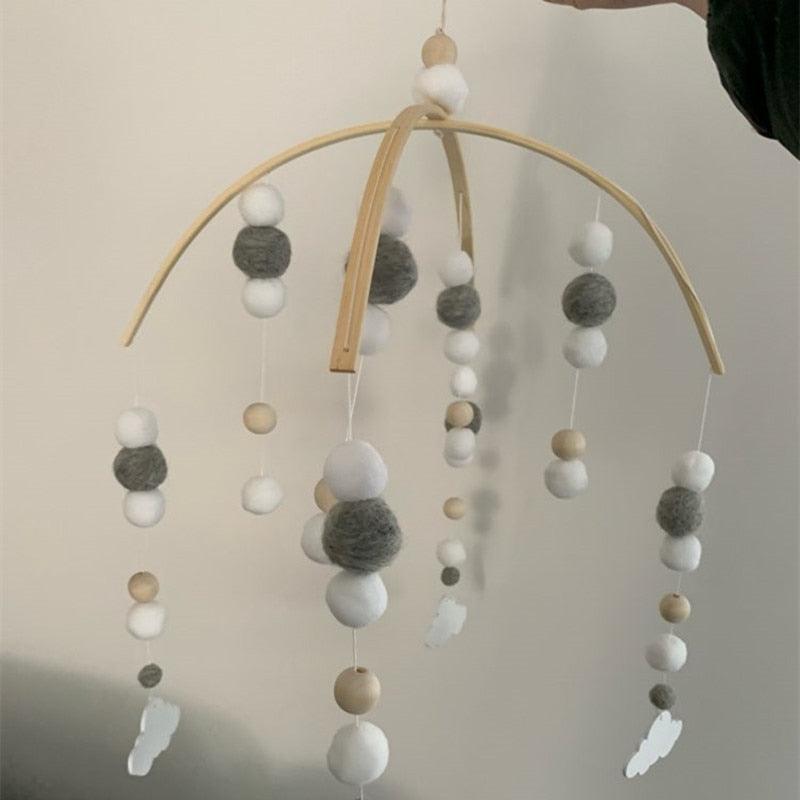 Stevvex baby crib mobile with Nordic wooden beads and white gray wool balls on curved arc on Tampa Home & Garden Store