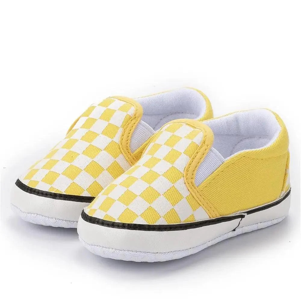 Pair of baby shoes yellow and white checker PU leather slip-on with soft sole on Tampa Home & Garden Store