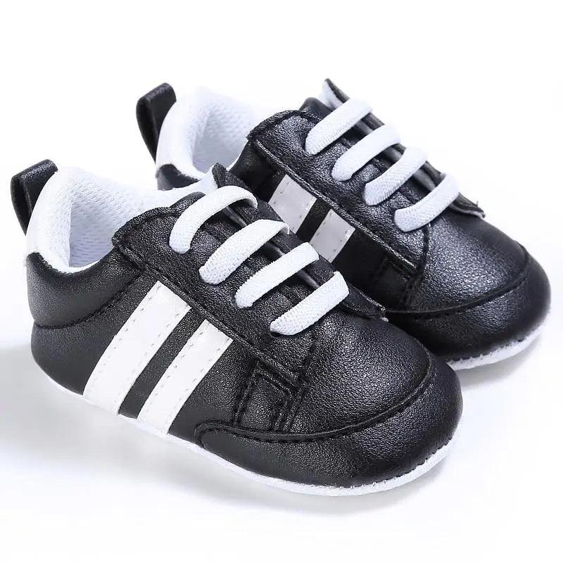 Stevvex baby sneakers pair black PU leather with white stripes soft sole on Tampa Home & Garden Store