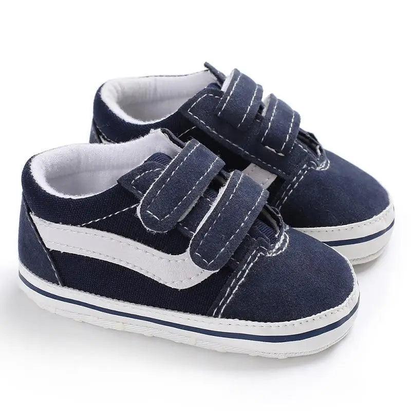 Baby sneakers pair Stevvex navy PU leather with white stripe and Velcro straps on Tampa Home & Garden Store