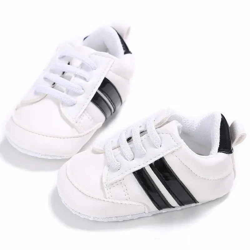Stevvex white PU leather baby sneakers with black side stripes soft sole pair on Tampa Home & Garden Store