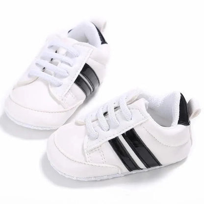 Stevvex white PU leather baby sneakers with black side stripes soft sole pair on Tampa Home & Garden Store