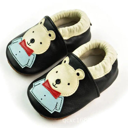 Black leather baby booties with cream lining and teddy bear applique, blue jacket, pair on Tampa Home & Garden Store