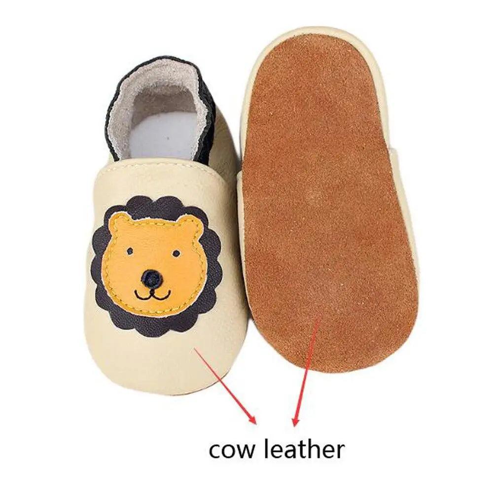Leather baby moccasin booties with lion applique, cream cow leather upper and suede sole on Tampa Home & Garden Store