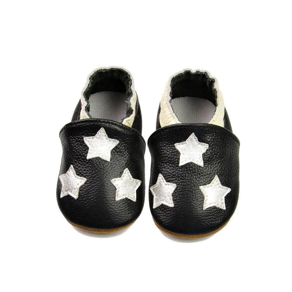 Stevvex baby leather moccasin booties, black with white stars, fluffy lining, pair on Tampa Home & Garden Store