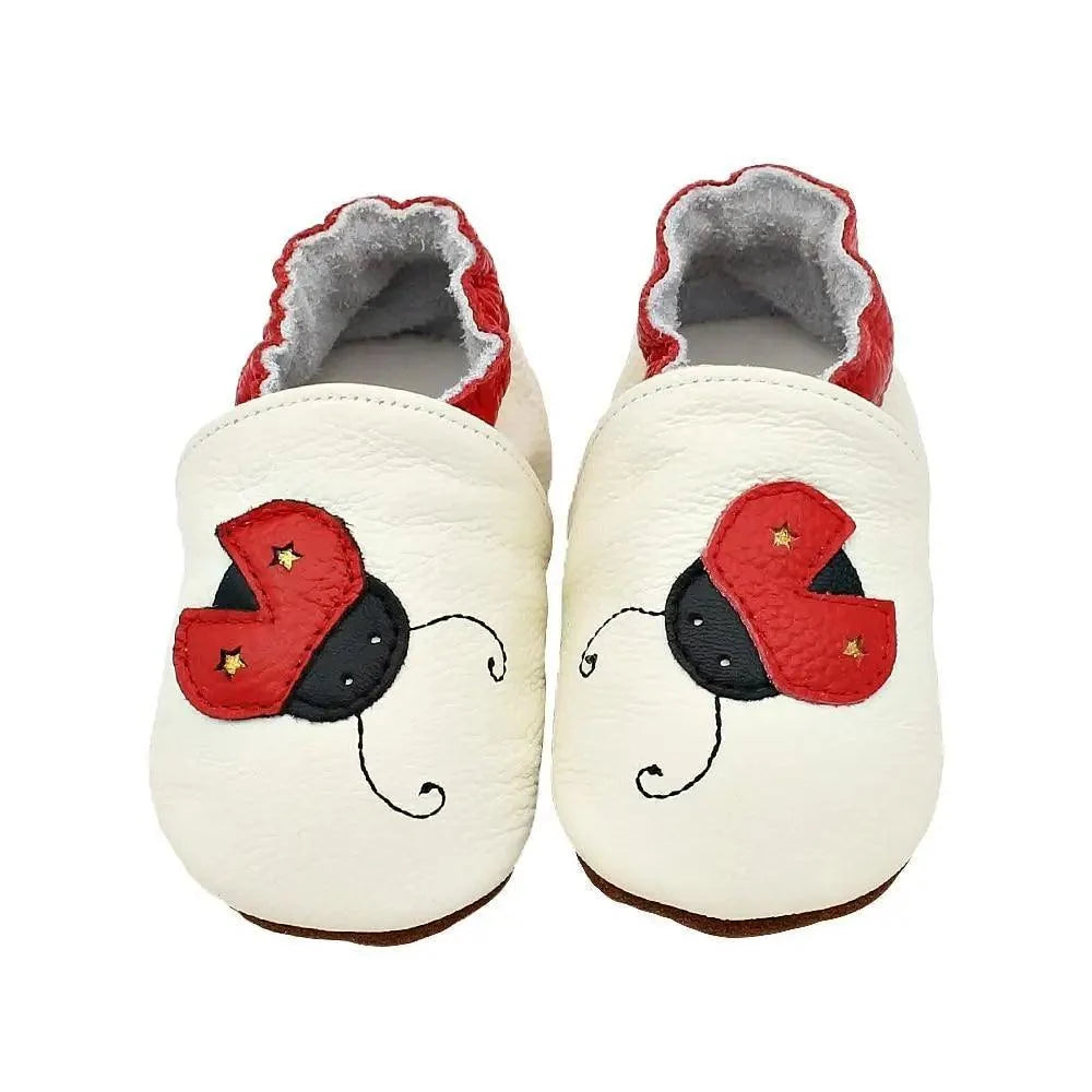 Baby leather newborn booties by Stevvex, white pair with red heart patches and gray lining on Tampa Home & Garden Store