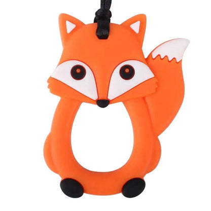Fox-shaped orange silicone teether ring with white facial accents and black eyes by Stevvex on Tampa Home & Garden Store