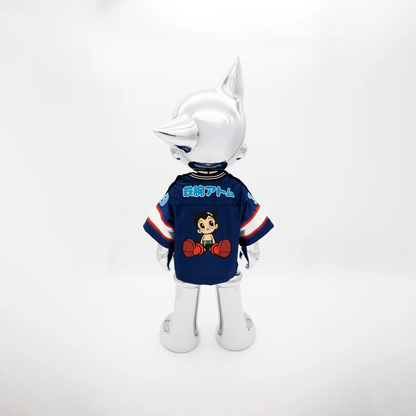 Astro Boy Reimagined action figure head in metallic silver, blue jersey with cartoon art on Tampa Home & Garden Store